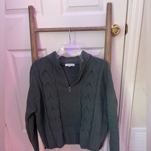 green sweater with quarter zip up